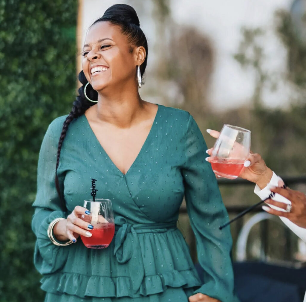 a-smiling-woman-holding-a-glass-of-red-wine